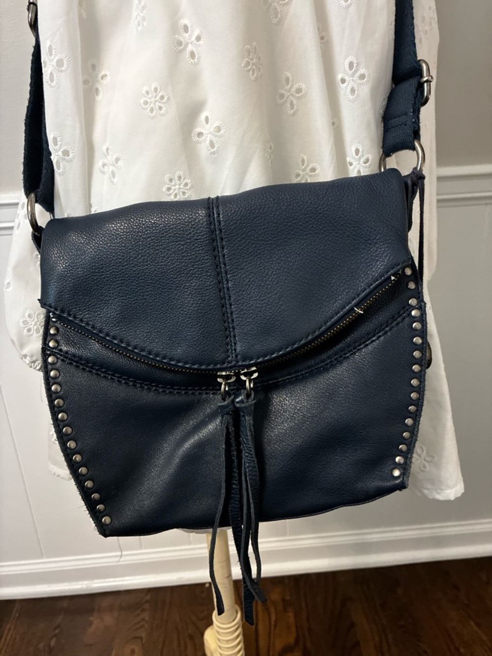 The Sak Navy Leather Silver Lake Crossbody with Stud Accents and Tassel Zipper
